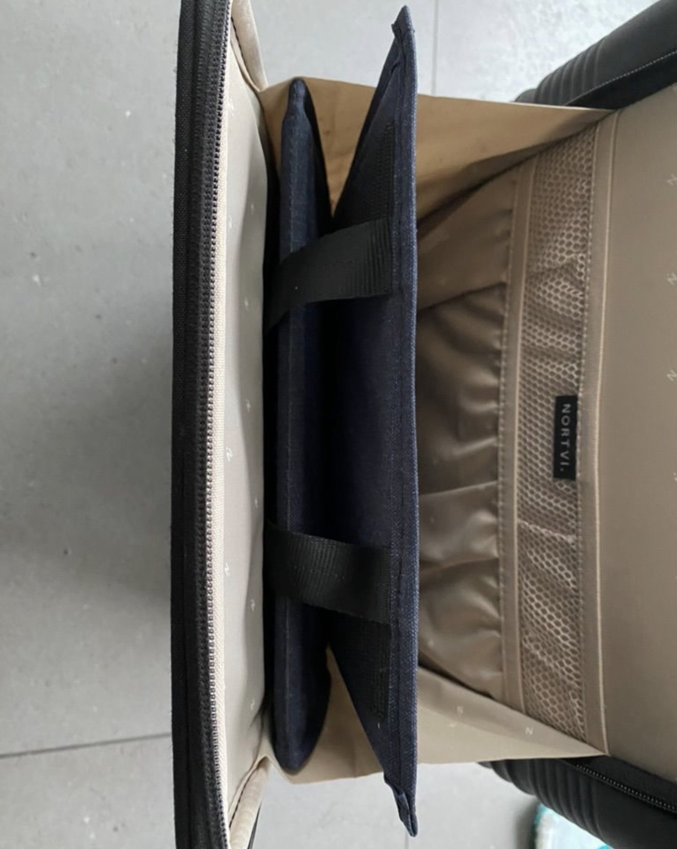 Aero Footrest folded upright in a packed carry-on